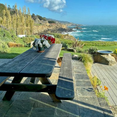 This table was built and delivered by founder Raul Hernandez in 2002 to Timber Cove. This style of Heritage table with 18' wide boards was discontinued because it was just too difficult to find sufficiently large reclaimed logs after 2009. The table is going strong after 20 years on the oceanfront!